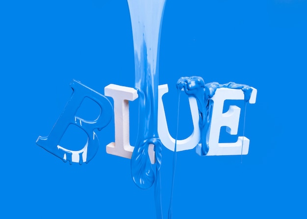 Paint dripping on floating word blue