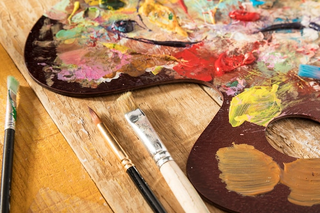 Paint palette with brushes and paint