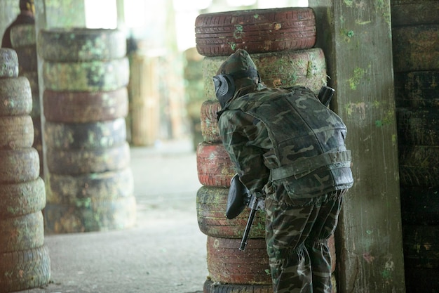 Paintball player in soldier outfits.