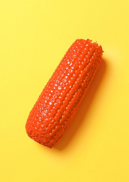 Painted corn on yellow surface