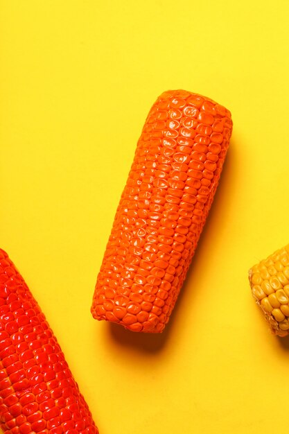 Painted corn on yellow surface