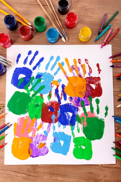 Painted handprints on a school desk