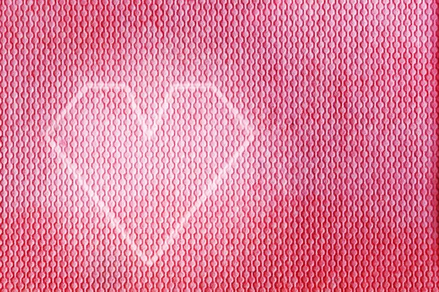 Painted heart on pink texture
