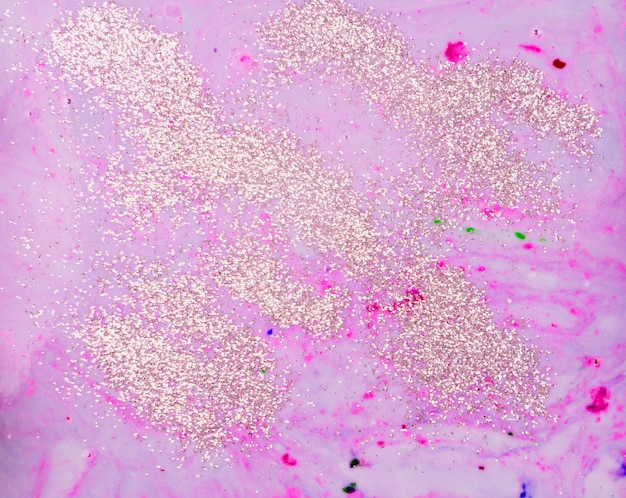 Foto gratuita acqua di colore rosa chiaro con paillettes