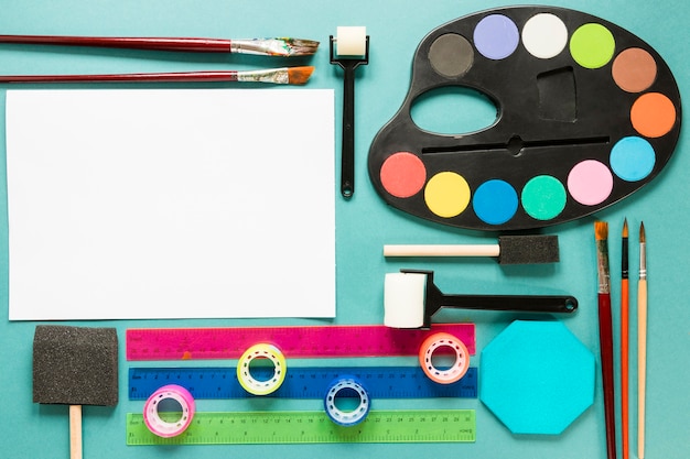 Free photo painting color palette with paper sheet