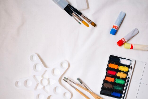 Painting supplies on white background