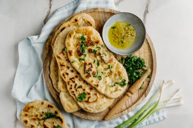 Pakistani food on wooden board flat lay