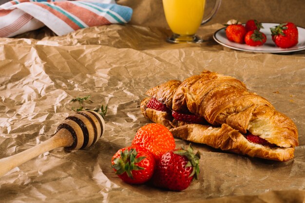 Palatable croissant and strawberries