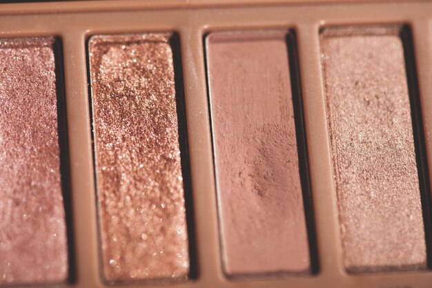 Palette of eye shadow in glitter pink shade closeup. selective focus,