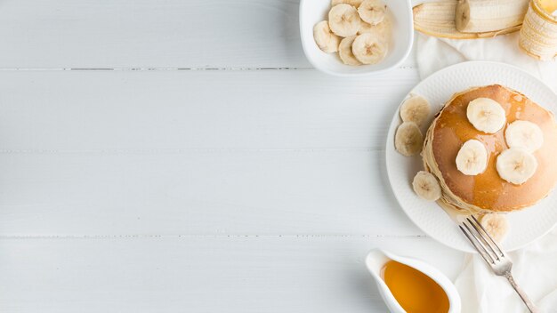 Free photo pancakes frame on white background