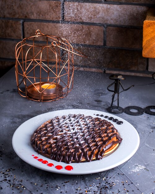 Pancakes with chocolade on the table