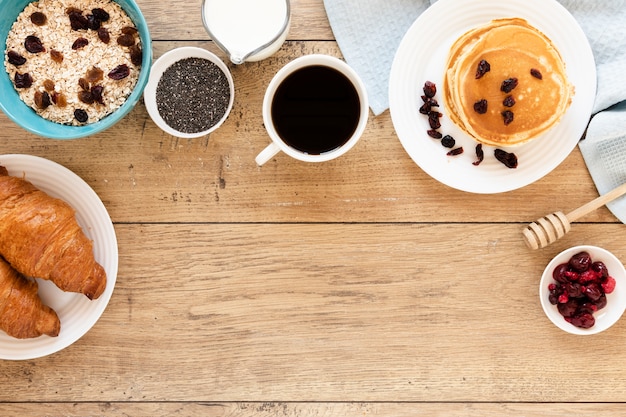 Pancakes with coffee croissants and copy space