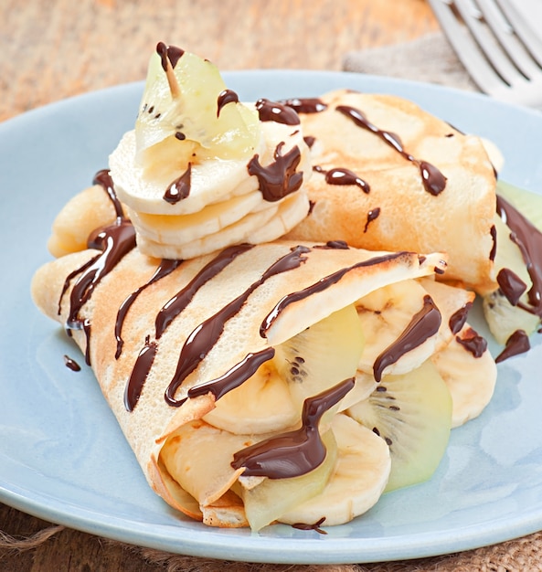 Pancakes with ice cream and chocolate sauce