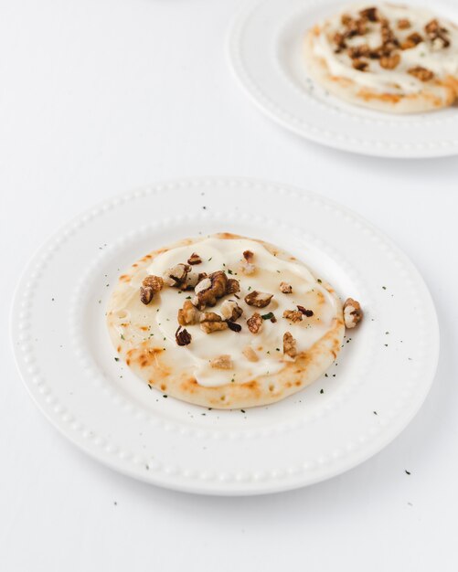 Pancakes with melted cheese and nuts