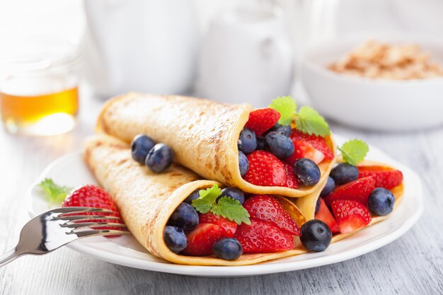 Premium Photo | Pancakes with strawberry blueberry