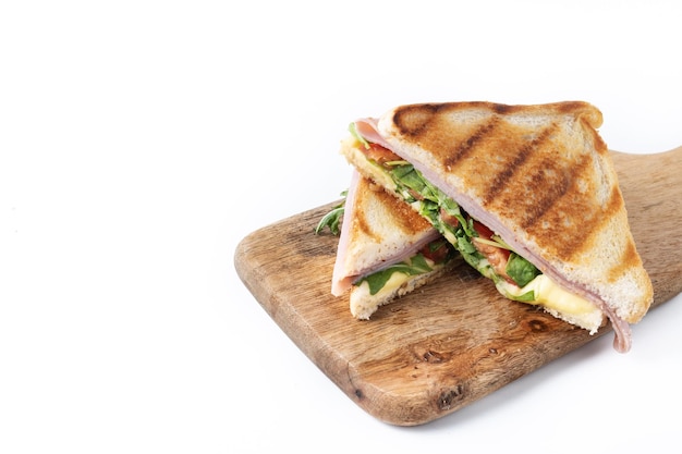 Panini sandwich with ham cheese tomato and arugula isolated on white background