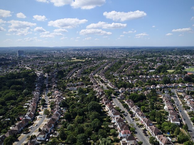 Panoramic shot of a cityscape with orderly streets and greenery