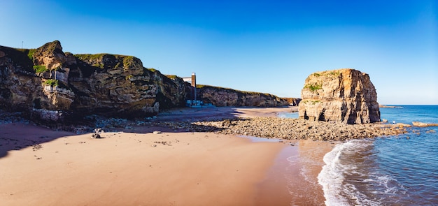 Panoramic shot of coast with rocks and coastline in South Shields, UK