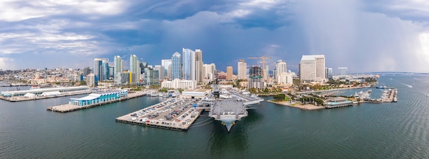 Panoramic shot of a coastal city under a cloudy sky