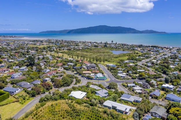 Free photo panoramic shot of a coastal town under blue skies