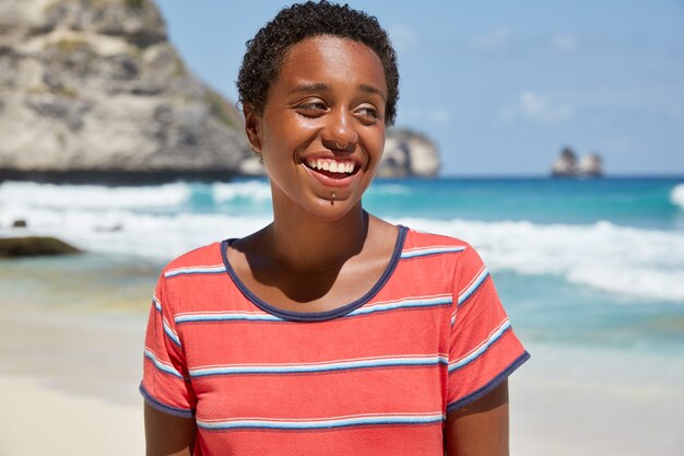 Panoramic view of black girl hipster has broad smile