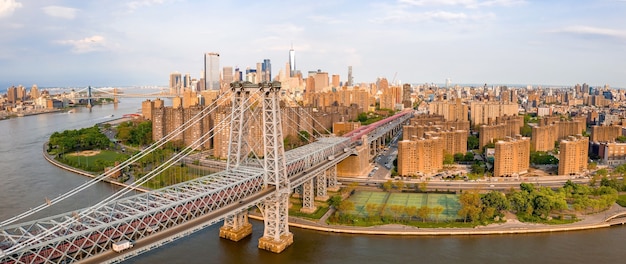 Panoramic view of a cityscape with a bridge tall buildings at daytime