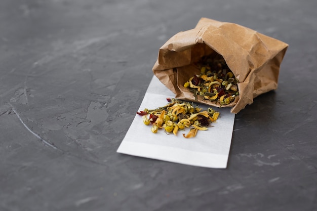 Paper bag filled with colorful tea buds