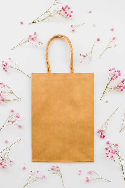 Paper bag among tender flowers 