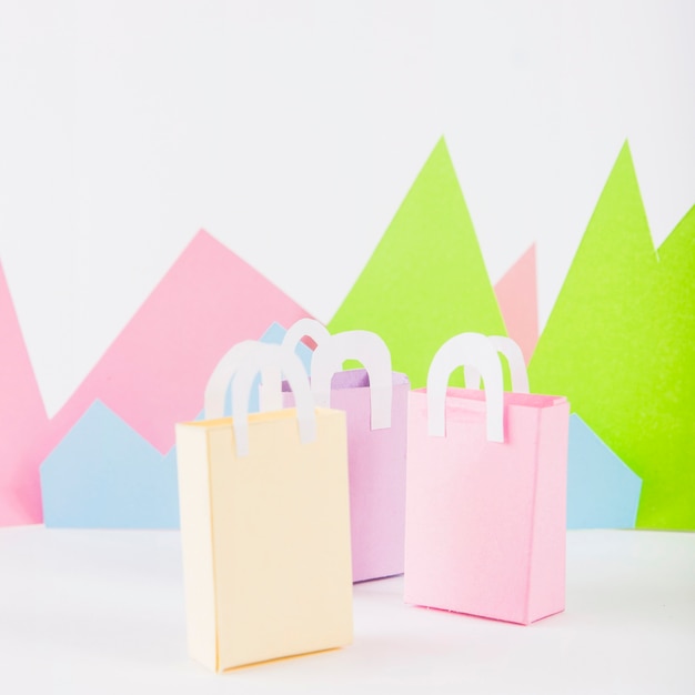 Paper bags with paper mountains on table