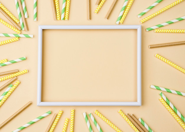 Free photo paper and bamboo eco straws empty frame