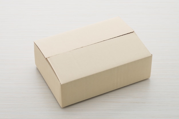 Paper box on wood background