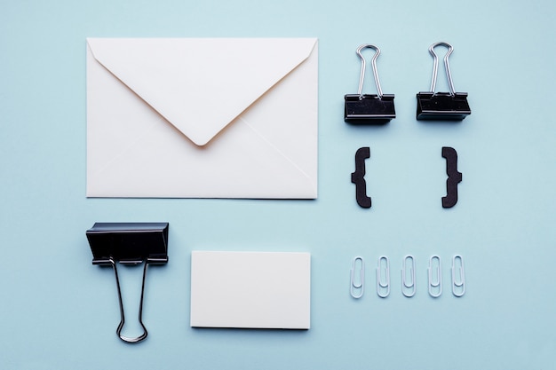 Paper clips with white business cards