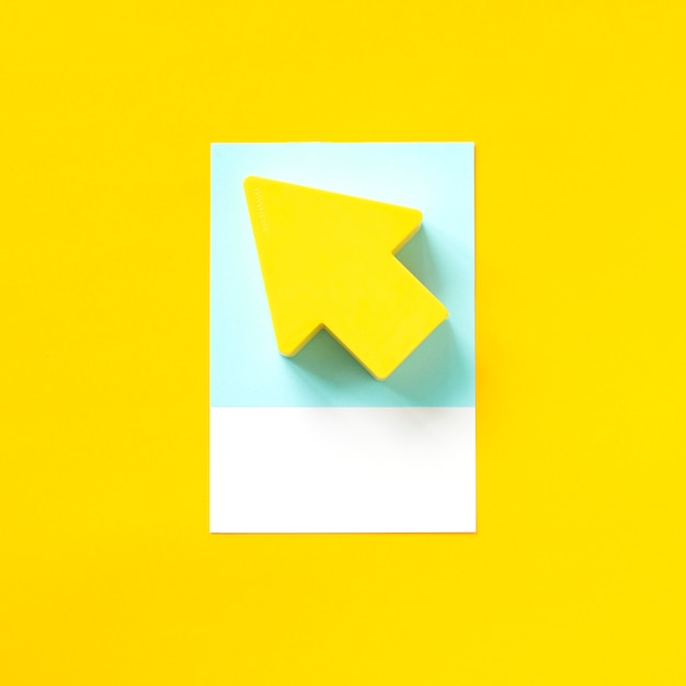 Paper craft art of a yellow arrow