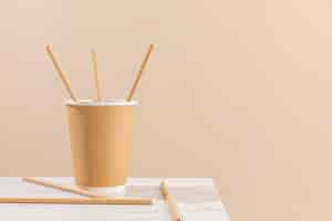 Free photo paper cup and straws arrangement