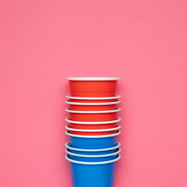 Free photo paper cups on pink background