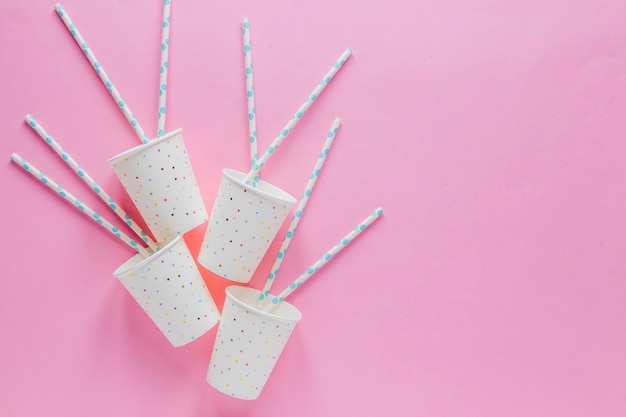 Free photo paper cups on pink