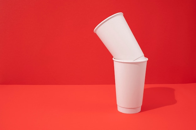 Paper cups with red background