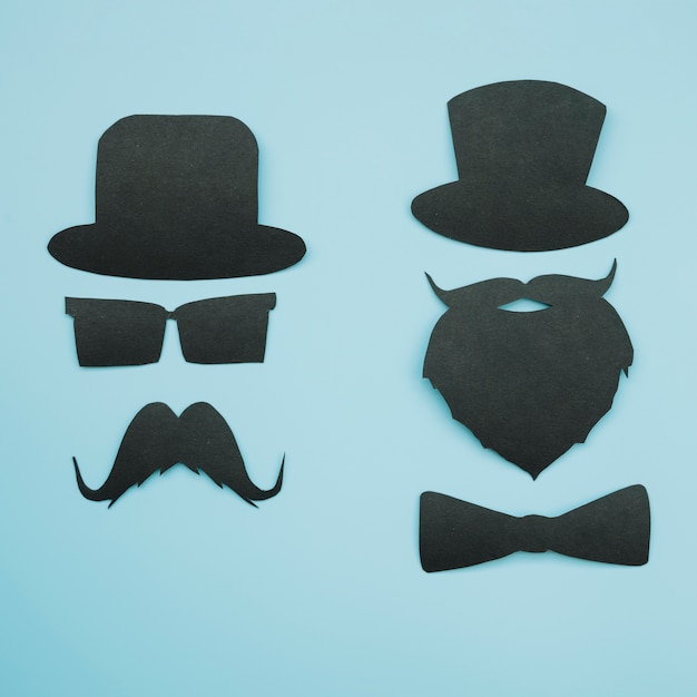 Paper cutouts of gentlemen in hats