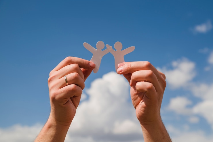 Free Photo paper dolls against sky