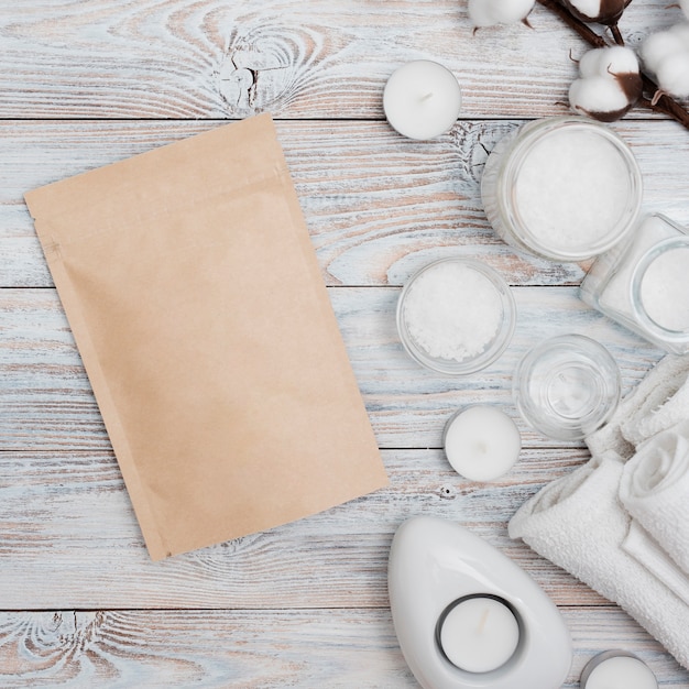 Free photo paper envelope with bath salts and candles