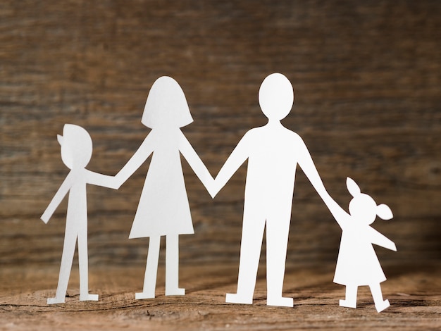 paper family on wooden background
