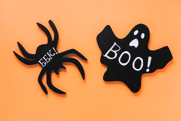 Paper ghost and spider with Boo! and Eek! inscriptions