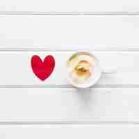 Free photo paper heart near cup of coffee