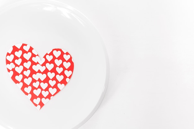 Paper heart on plate