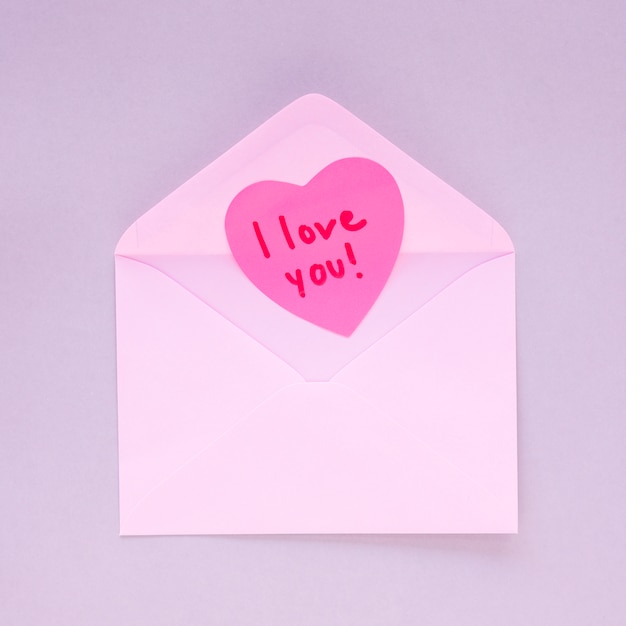 Paper heart with I love you inscription in envelope