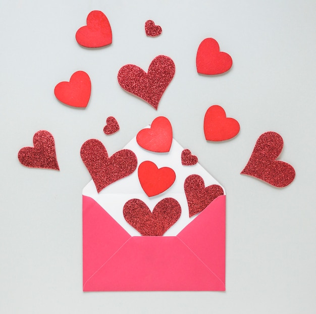 Paper hearts scattered from envelope