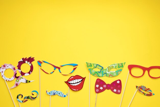 Paper masks on yellow background