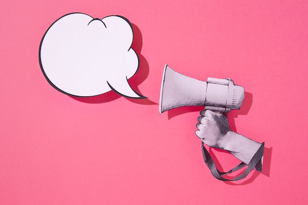 Paper megaphone and speech bubble