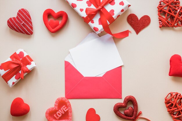 Paper near envelope, presents and ornament hearts 