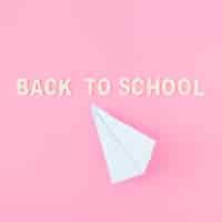 Free photo paper plane near back to school writing